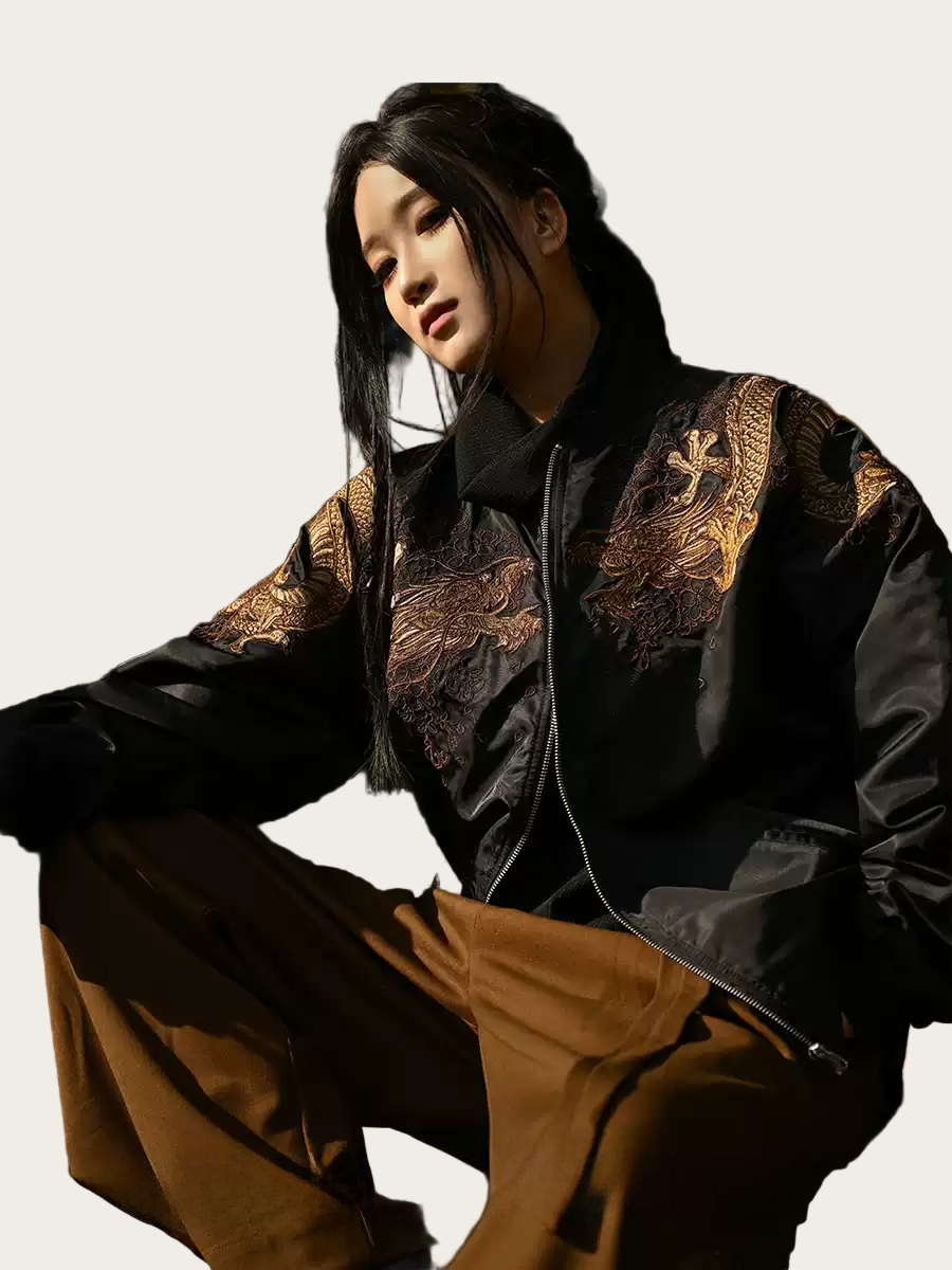 Person wearing a black and gold traditional outfit on a white background