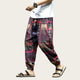 Person wearing patterned harem pants and sandals.