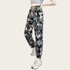 Camouflage pants worn by a person on a yellow background