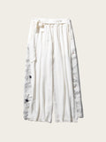White pants with black patterns on a white background