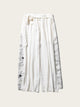 White pants with black patterns on a white background
