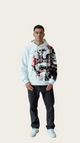 Person wearing a white hoodie with a colorful graphic design on a plain background