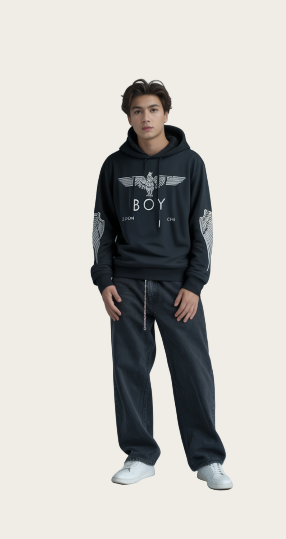 Person wearing a black hoodie with 'BOY' logo on a gray background