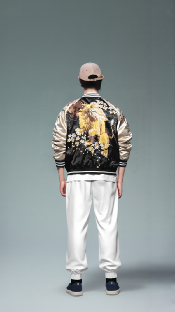 Person wearing a stylish jacket with floral design on a plain background