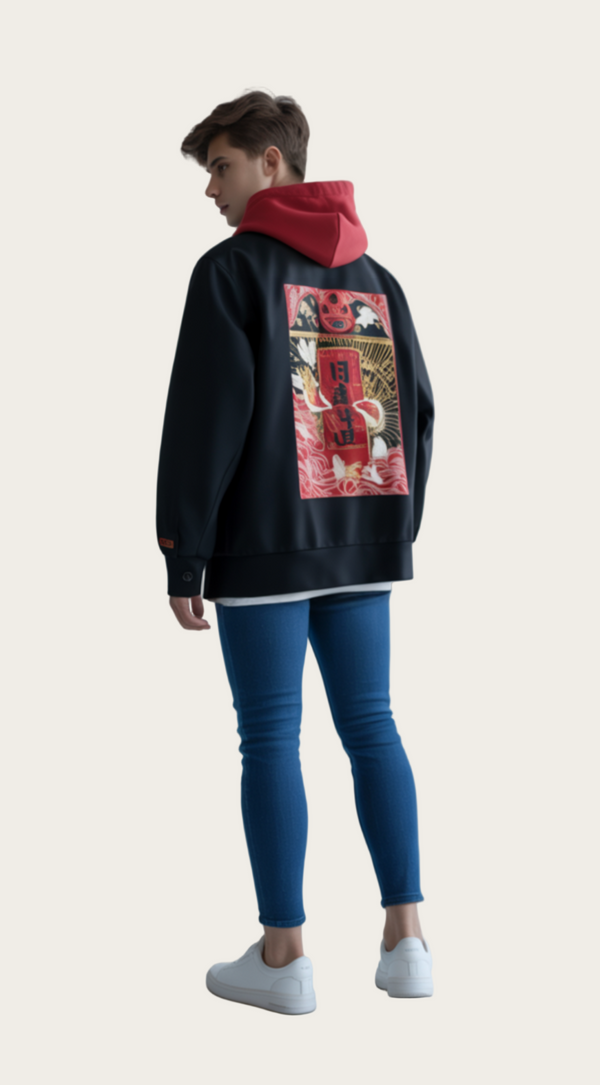 Person wearing a black hoodie with a colorful design on the back, standing against a plain background.