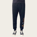 Black pants with dragon embroidery on a white background