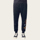 Black pants with dragon embroidery on a white background