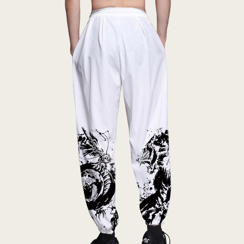 White pants with black abstract designs on a plain background