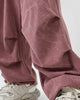 Close-up of the pleated knee on the pink corduroy pants
