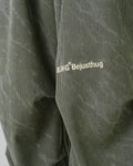 Close-up of the embroidered BJHG Bejusthug logo on the olive green pants