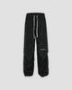 Black acid-wash corduroy parachute pants with a drawstring hem, front view