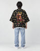 Full-length back view of a man in the black haori with tan clouds and an armored cat holding a sword, with light jeans
