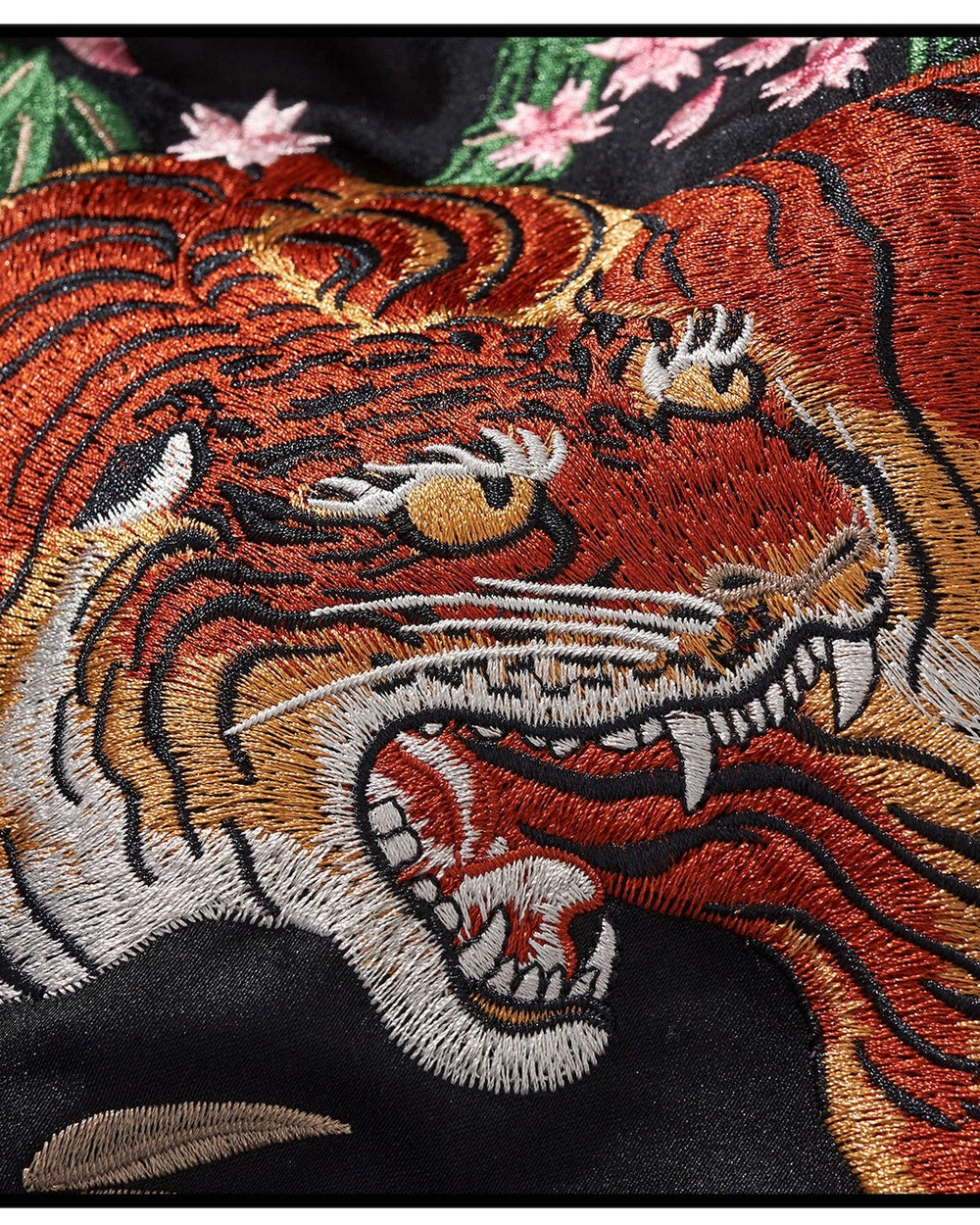 Close-up of the embroidered tiger's face and stripes