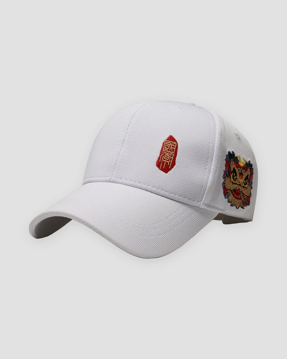 White baseball cap with a small red seal stamp on the front and a lion-dance head on the side