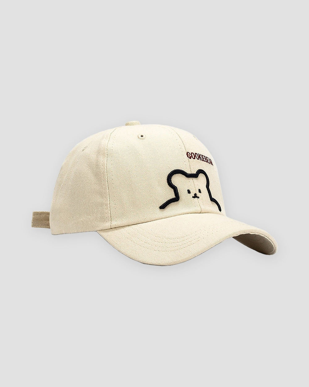Cream bear outline embroidered baseball cap, three-quarter view
