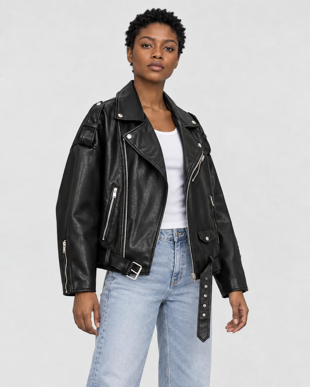 Model wearing the belted PU leather biker jacket, three-quarter view