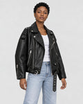Model wearing the belted PU leather biker jacket, three-quarter view