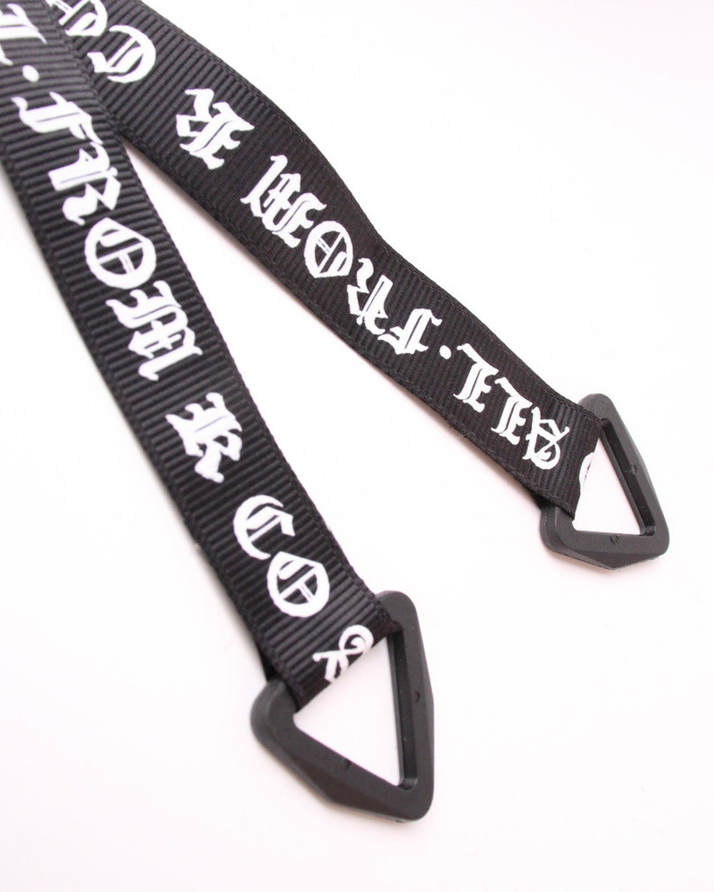 Close-up of the blackletter ribbon tails ending in black triangle loops