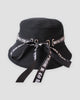 Black bucket hat with the ribbon tied in a bow and long trailing tails