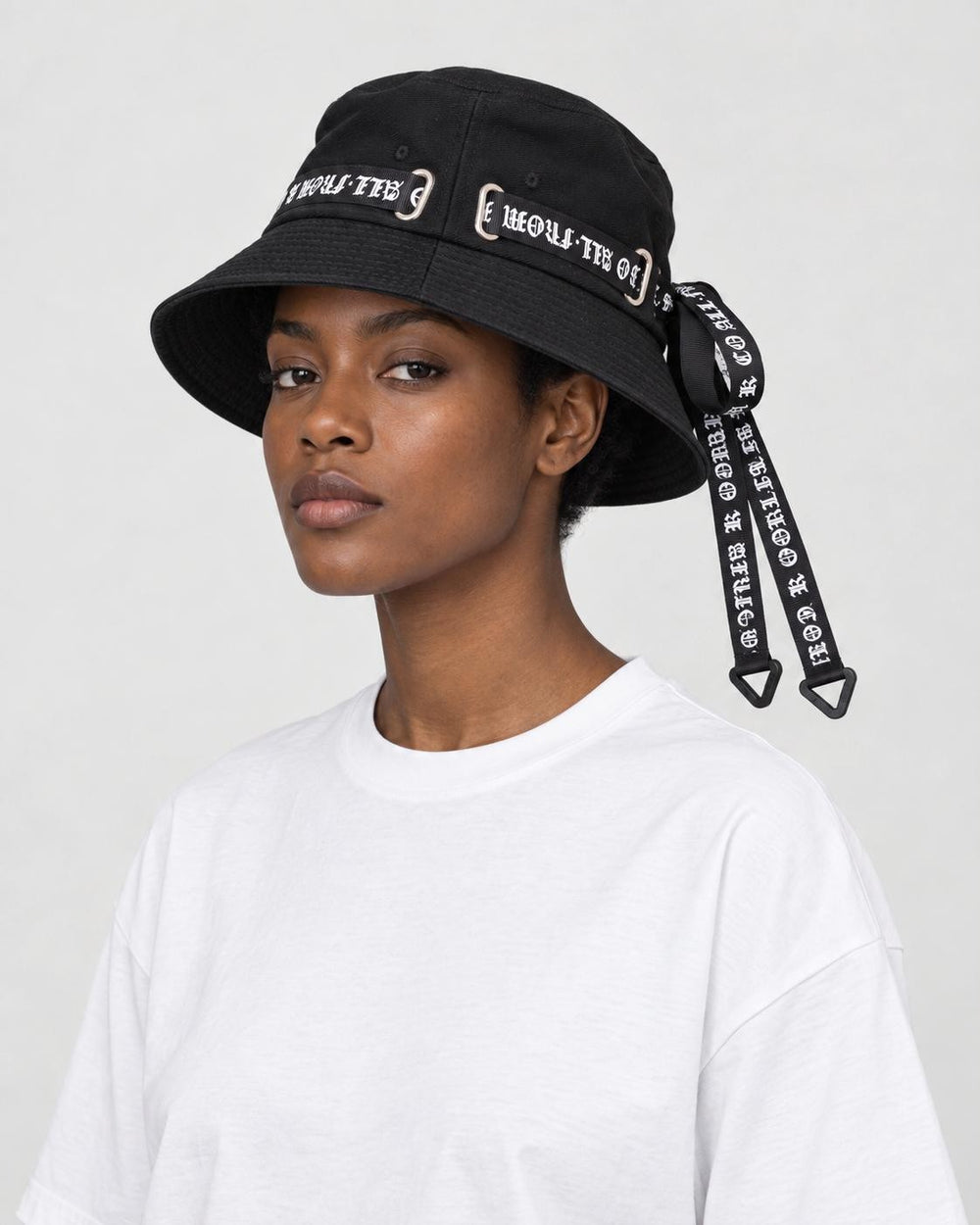 Model wearing the black ribbon bucket hat, side view