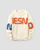 Cream letter print sweatshirt with orange letters and a blue N, front view