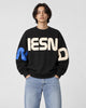 Model wearing the black block letter print sweatshirt, front view
