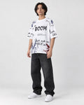Model wearing the white BOOM graffiti print T-shirt, three-quarter view