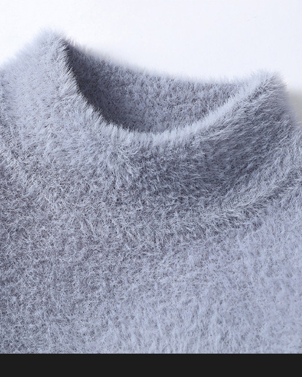 Close-up of the mock neck on the blue gray sweater