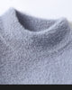Close-up of the mock neck on the blue gray sweater