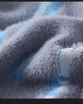 Close-up of the soft fuzzy pile and a light blue brushstroke