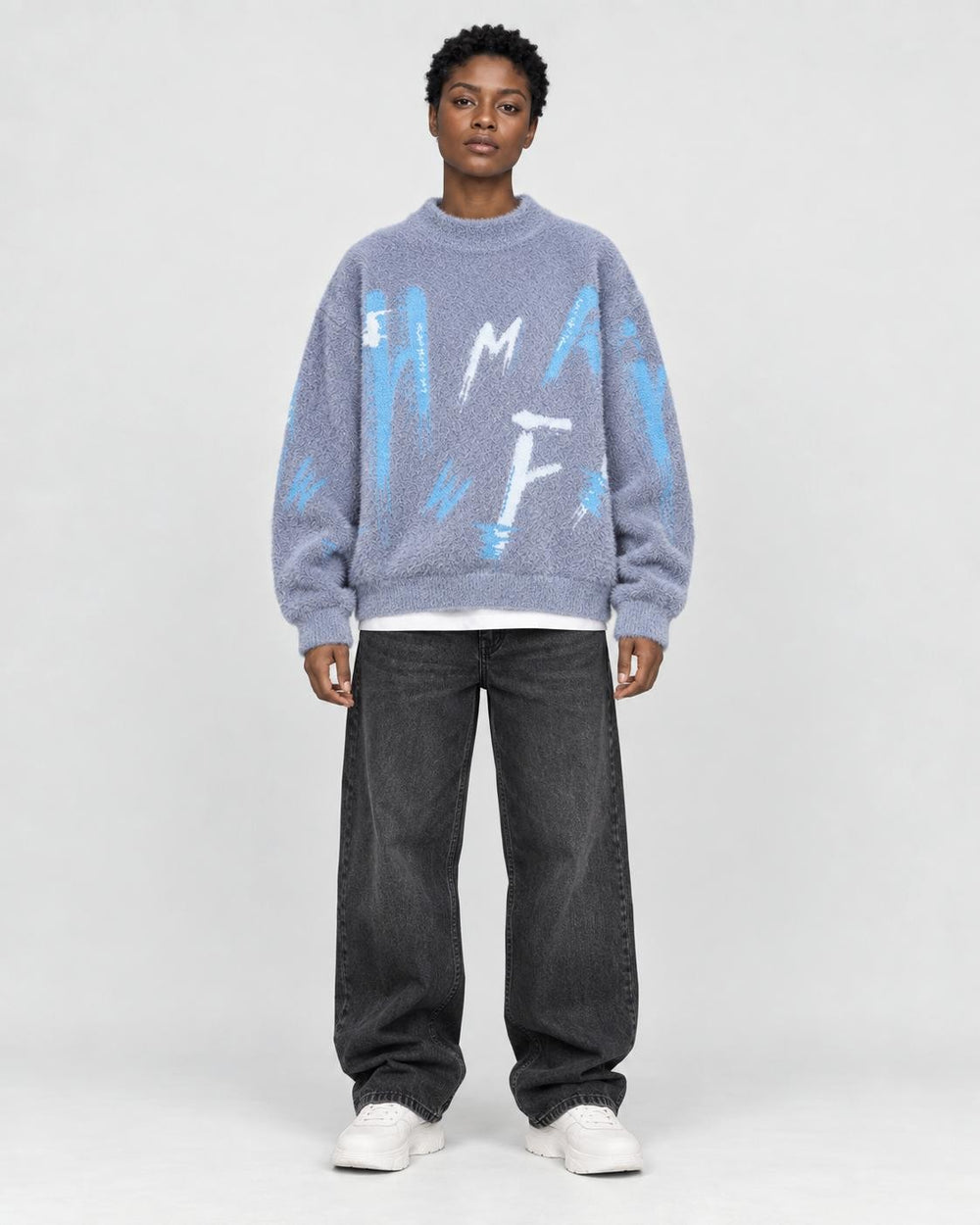 Model wearing the blue gray fuzzy knit sweater, front view