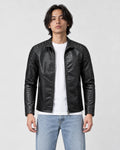 Model wearing the black PU leather jacket open over a white tee, front view