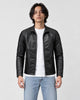 Model wearing the black PU leather jacket open over a white tee, front view