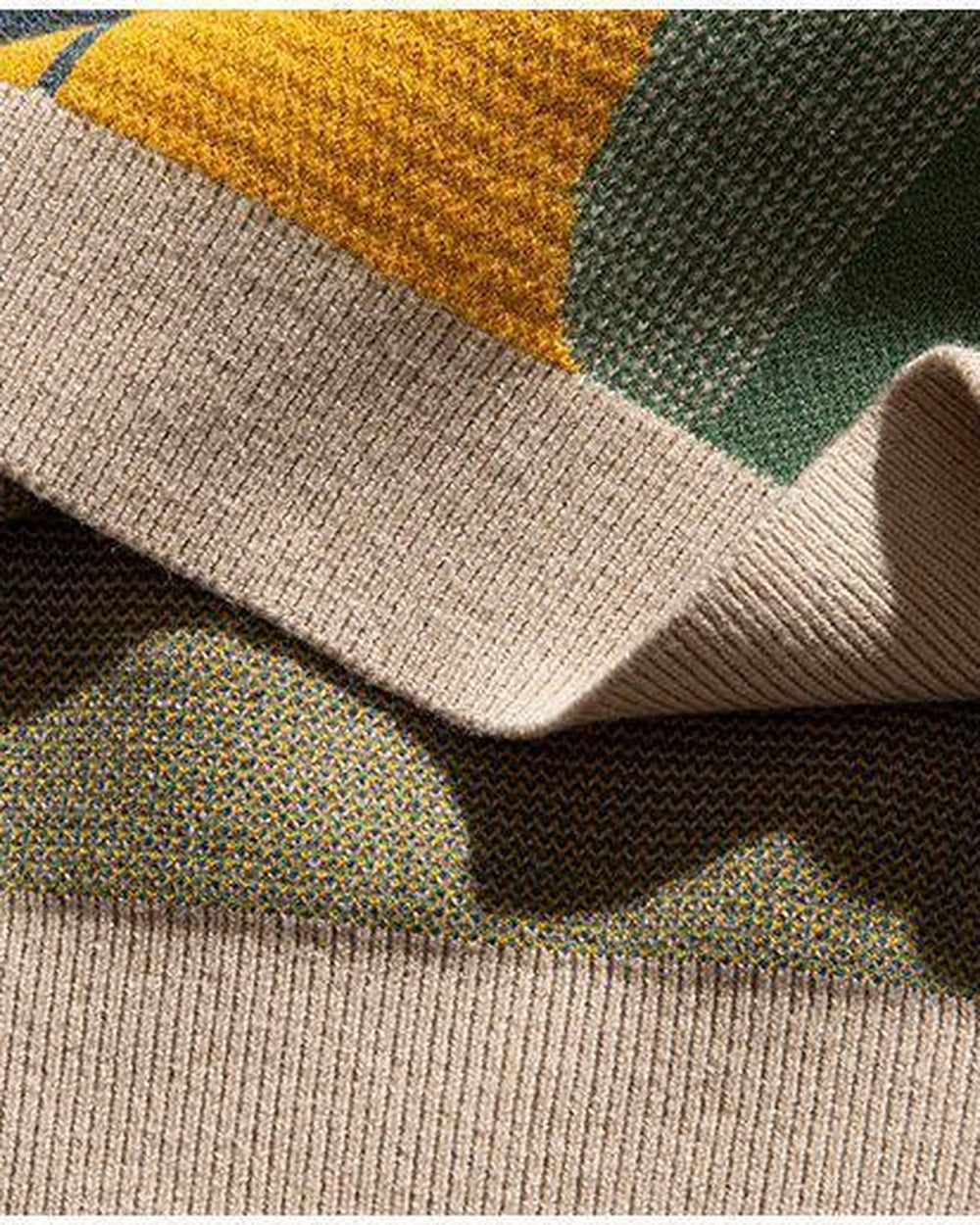 Close-up of the knitted scene and ribbed hem