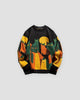 Black knit sweater with green, orange and mustard cats under a yellow moon