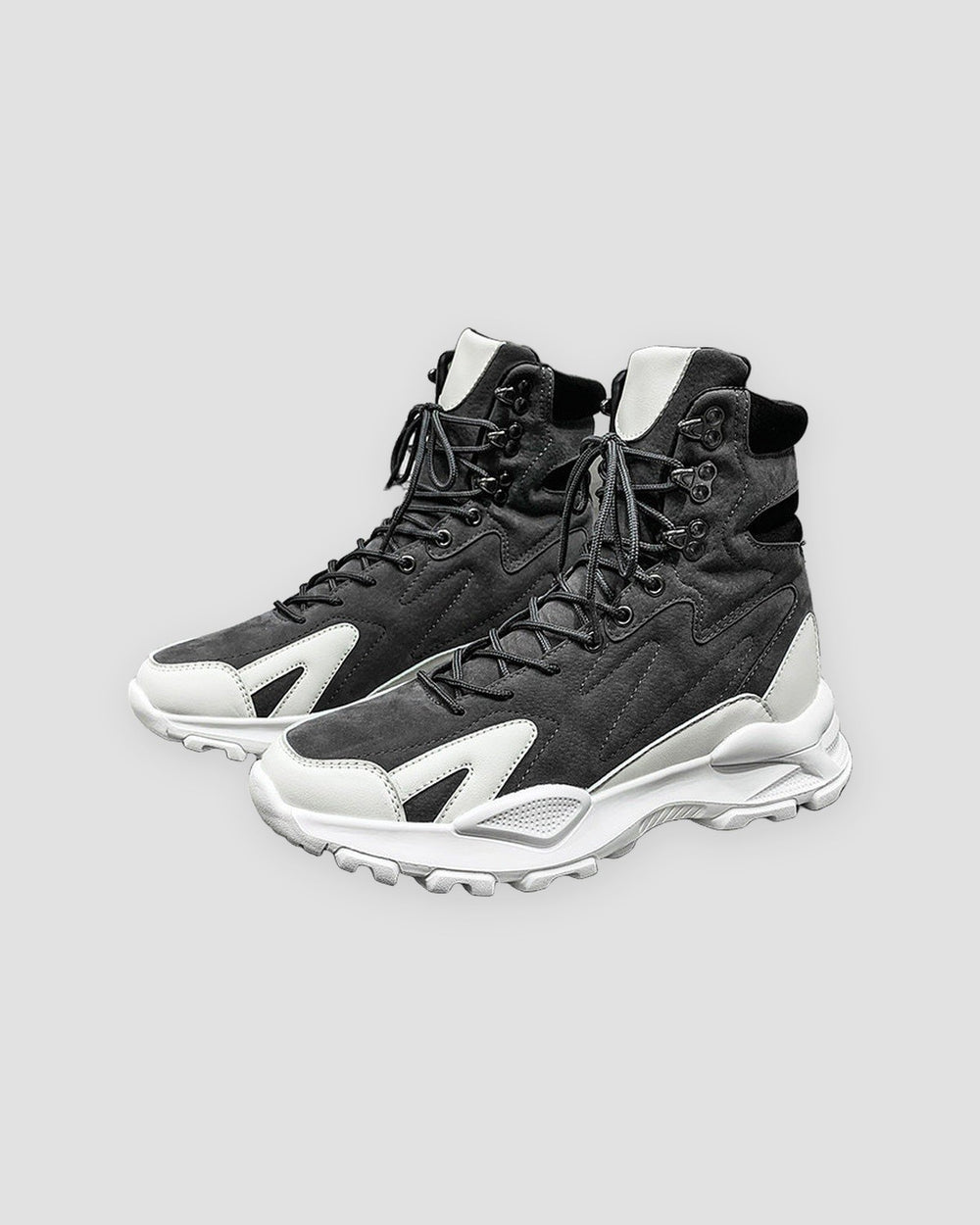 Gray high-top sneakers with white wing overlays and a chunky white sole, side view