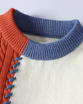 Close-up of the blue ribbed collar and orange cable patch