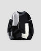 Black sweater with gray and white cable-knit patches, front view
