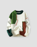 Cream sweater with green and brown cable-knit patches, front view