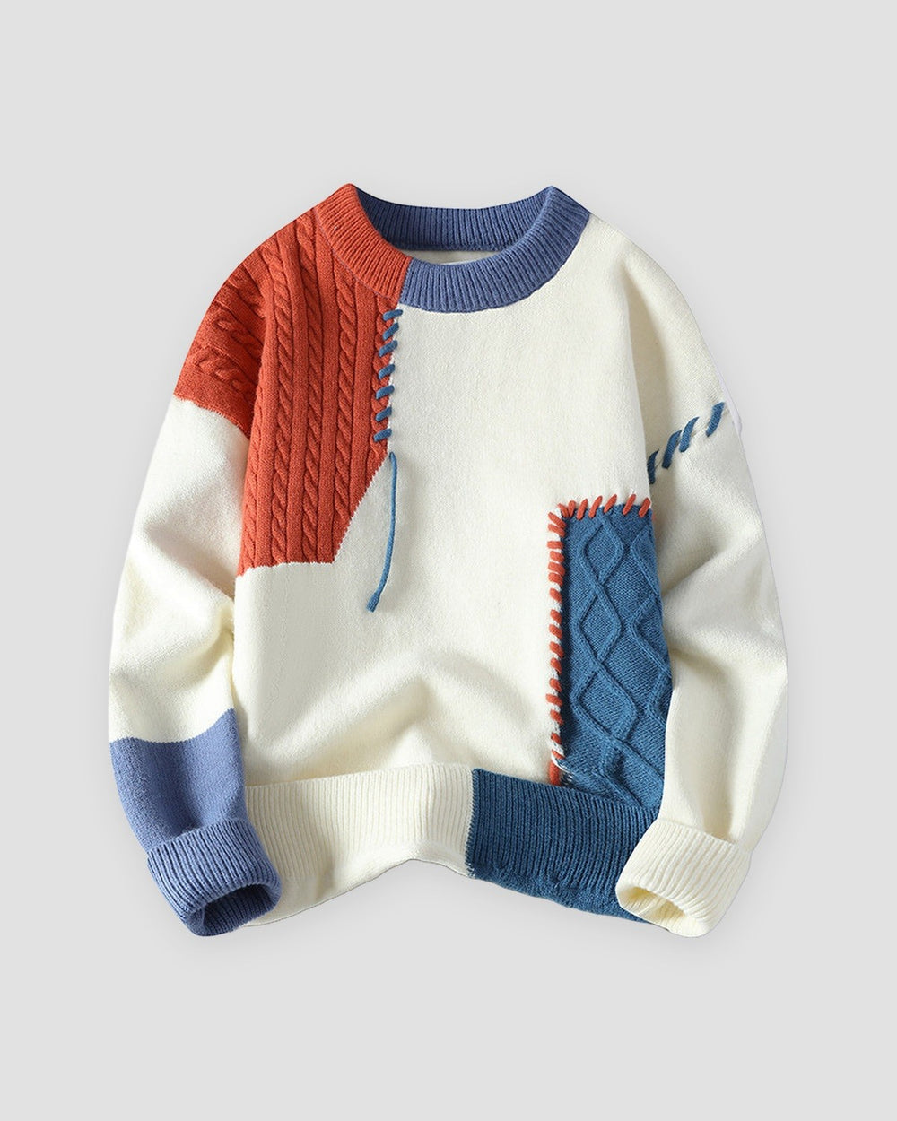 Cream sweater with orange and blue cable-knit patches, front view