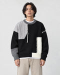 Model wearing the black cable patch sweater, front view