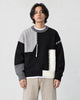 Model wearing the black cable patch sweater, front view