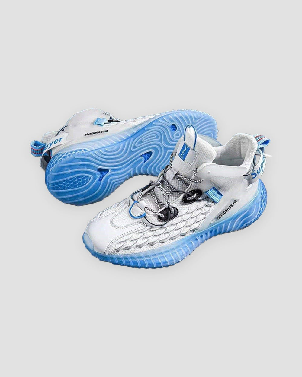 Pair of white and blue knit running sneakers with blue soles
