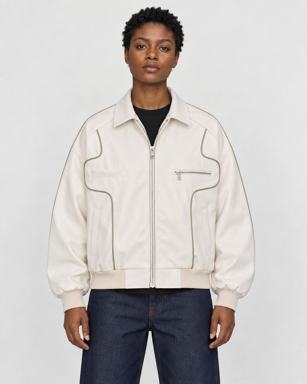 Model wearing the white PU leather jacket with contour piping, front view