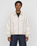 Model wearing the white PU leather jacket with contour piping, front view