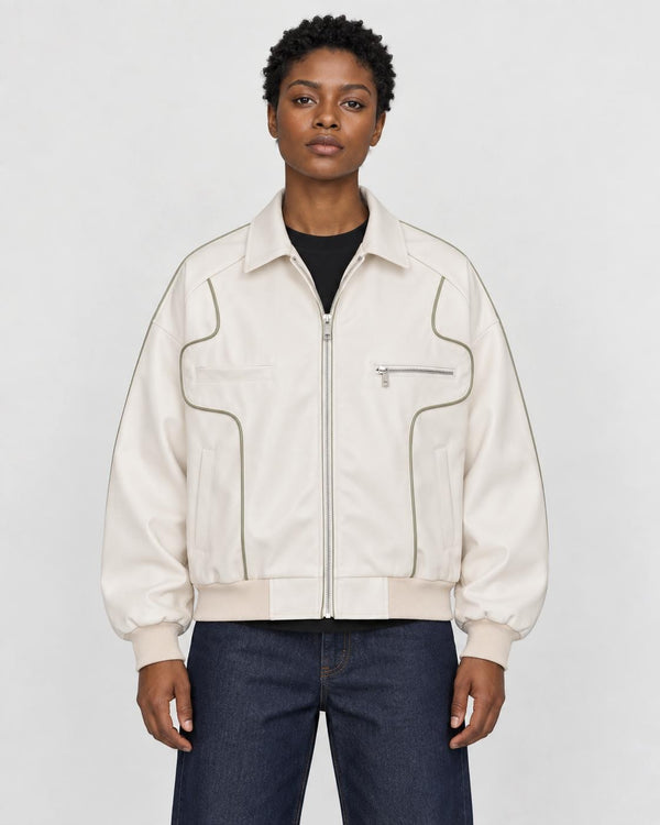 Model wearing the white PU leather jacket with contour piping, front view
