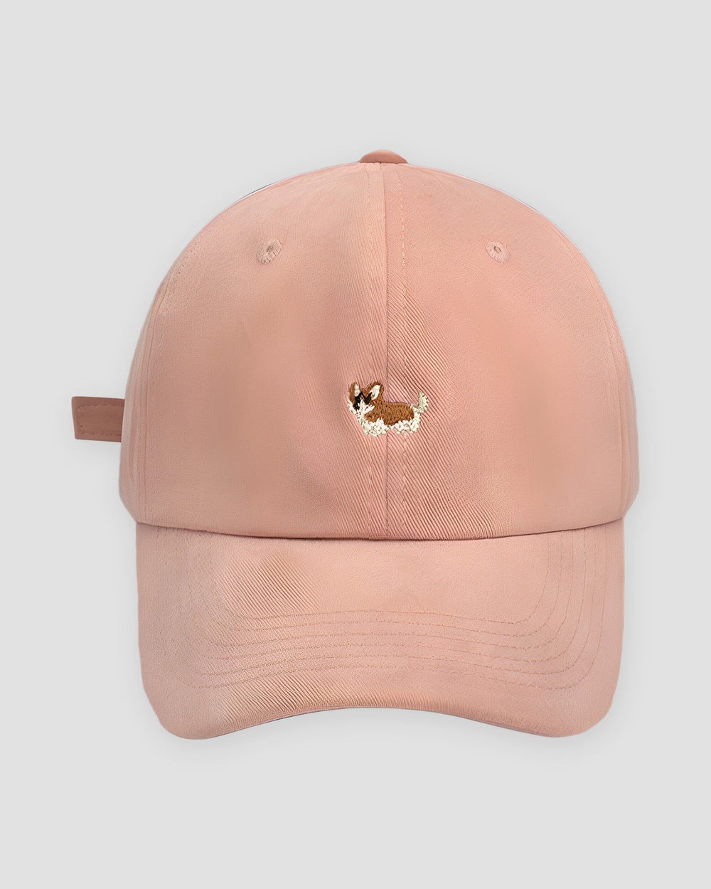 Pink cotton baseball cap with a small embroidered corgi on the front
