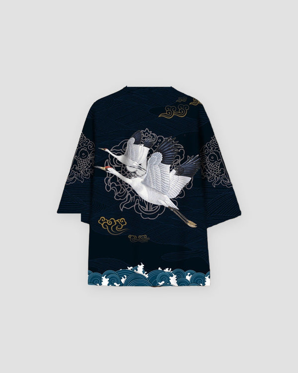 Dark navy haori on a hanger, back view with two white cranes in flight, gold clouds and teal waves along the hem