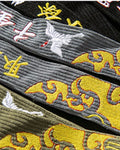 Close-up of the crane and golden cloud embroidery on the tapes