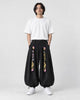 Model wearing the black crane embroidered corduroy pants, front view